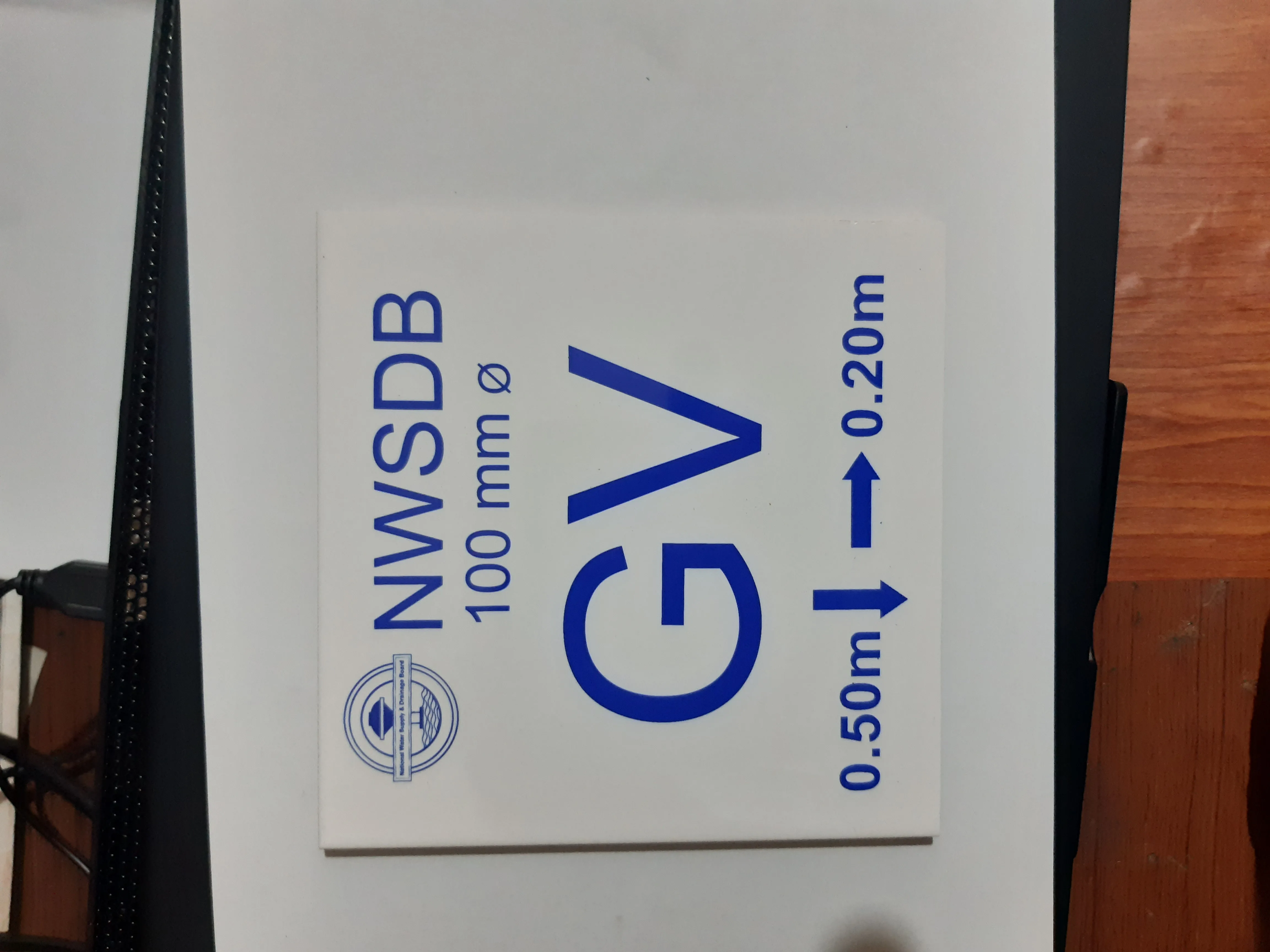 NWSDB GV road marking tile — utility marker for highway infrastructure