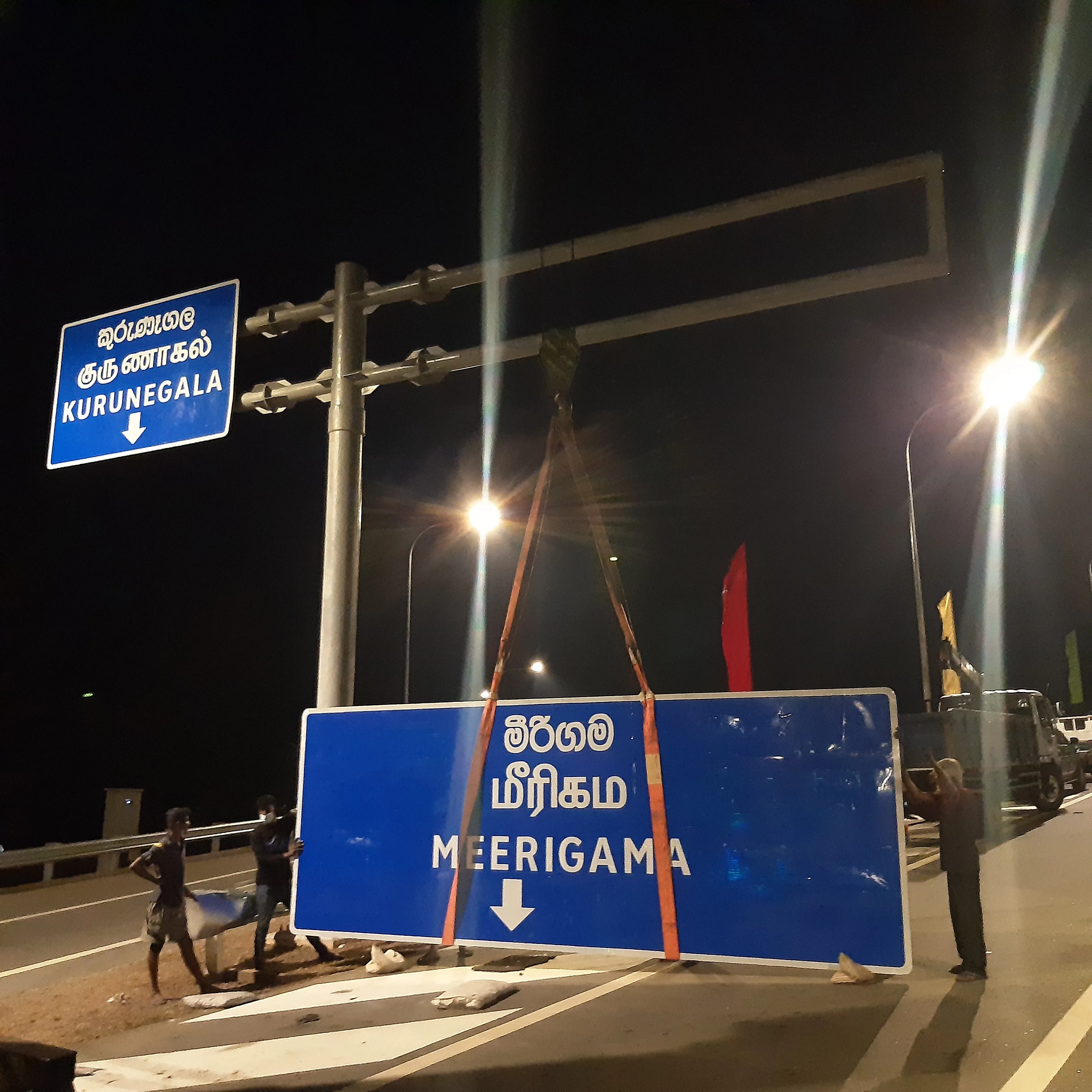Meerigama and Kurunegala direction sign installation at night on expressway