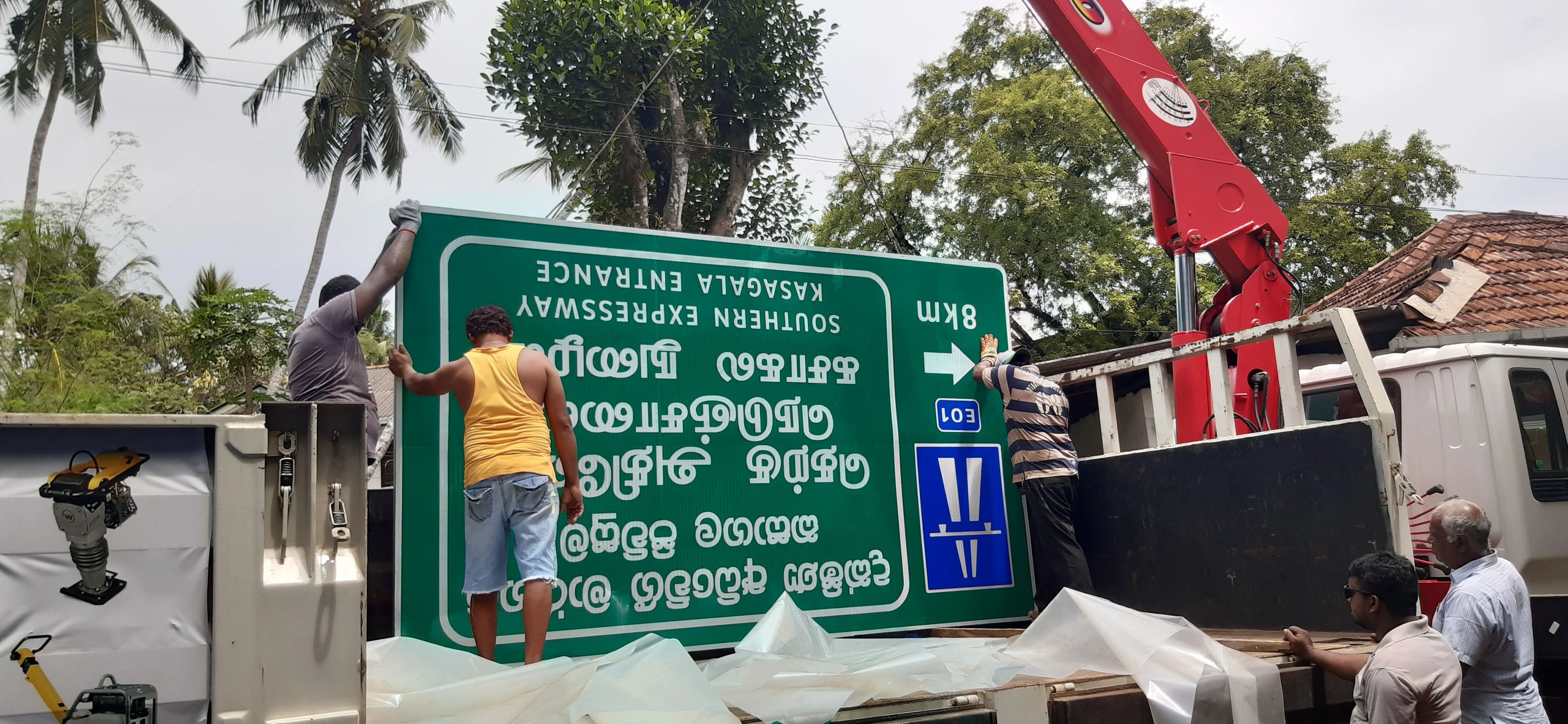 Highway sign board installation with safety signage and reflective road markings
